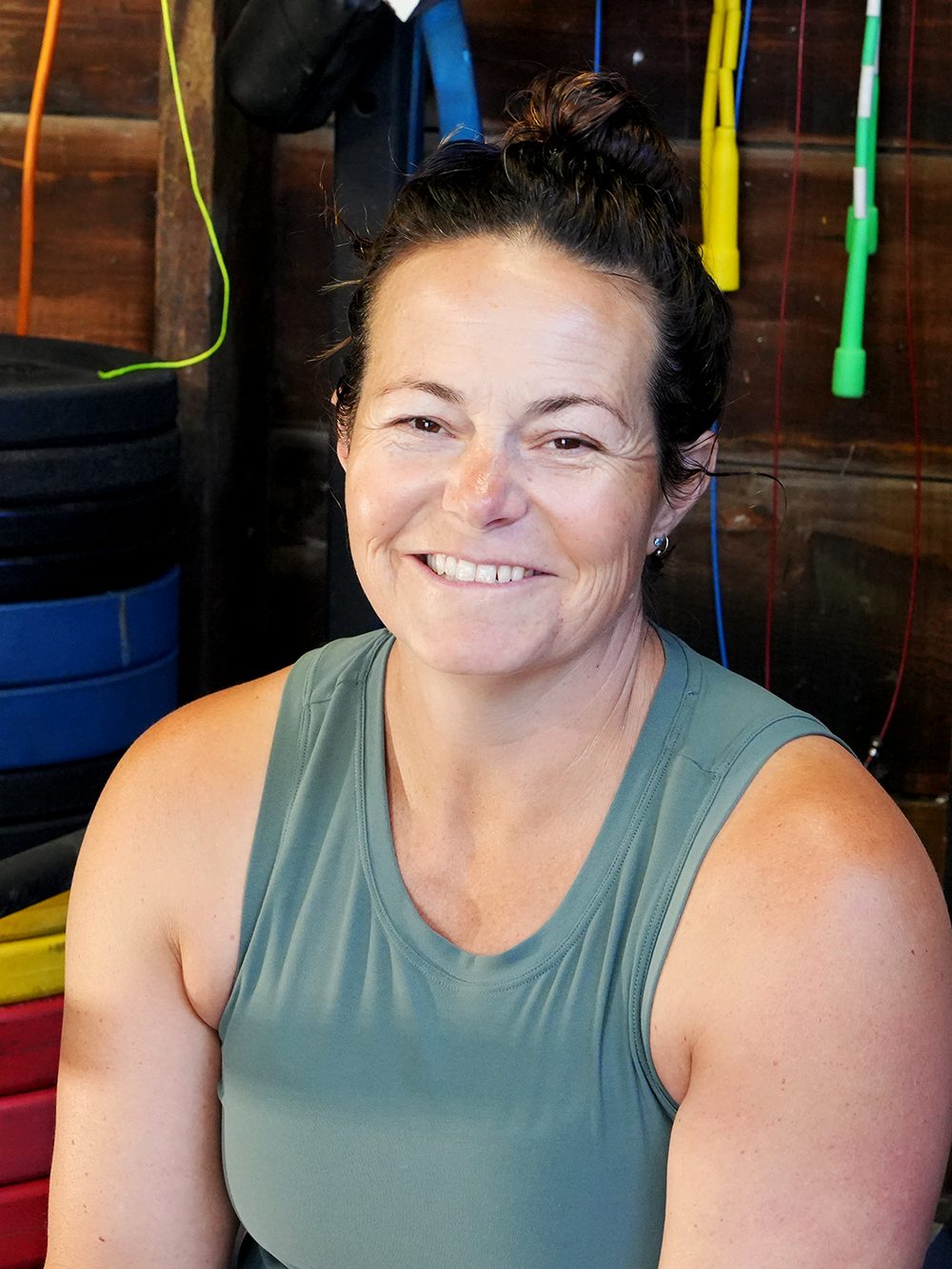 Coach Danielle smiling in her gym